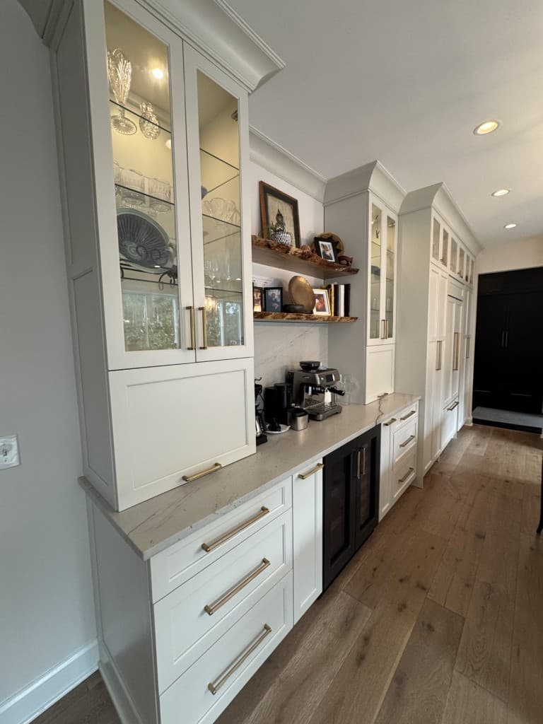 Original vertical cell phone photo of white kitchen cabinetry